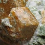 Grossular. 
Maine, USA
6 x 5 cm.
Close-up of the previous specimen. Detail of the smaller crystal.
It could be from Casco or Limerick. See: http://www.mineral-forum.com/message-board/viewtopic.php?p=37646#37646 (Author: Antonio Alcaide)