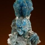 Scorodite xls with Quartz xls
Tsumeb, Namibia
Size: Cabinet - 3.9 cm. high

Specimen: William Pinch Collection
Photo: Jeff Scovil &amp; The RRUFF Project (Author: Pinch Bill)