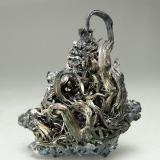 Plata con Acanthita
Mina Himmelsfürst, Freiberg, Erzgebirge, Sajonia, Alemania 
Encontrada en 1995
Tamaño de la pieza: 2.7 × 2.4 × 1.4 cm.
El cristal más grande mide: 1.5 × 0.2 cm.
Foto: Ejemplares de Referencia (Autor: Jordi Fabre)