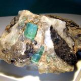 Beryl var. Emerald on calcite matrix
Emerald Mines in Muzo, Colombia
7 x 5 x 6 cm
 (Author: Leon56)
