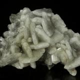 Barite
Warren District, Bisbee, Cochise County, Arizona, USA
75 x 60 x 37 mm

White blades of Barite form interlocking groups, with blades reaching 2.2 cm on edge.  These are quite rare. (Author: GneissWare)