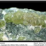 Andradite variety demantoid
Val Malenco, Italy
fov 8 mm (Author: ploum)