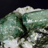 Beryl var. Emerald
Pizzo Marcio, Trontano, Vigezzo Valley, Ossola Valley, Verbano-Cusio-Ossola Province, Piedmont, Italy
Group of two Emerald crystals of 9.25 and 10.34 mm (Author: Matteo_Chinellato)