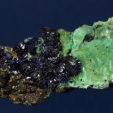 Azurite with Malachite
Copper Queen Mine, Warren District, near Bisbee, Cochise County, Arizona, USA
73 x 32 x 27 mm
Numerous, lustrous, dark blue Azurite rosettes to 10 mm cover half of the specimen. Light green Malachite completely covers the other half of the specimen. The specimen is circa 1957. Formerly in Tom Hales personal collection. (Author: GneissWare)