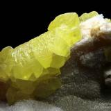 Sulphur
Cozzodisi Mine, Casteltermini, Agrigento Province, Sicily, Italy
Nice item with some big green Fluorite cubes and groups of crystals. Cube = 1 cm (Author: Matteo_Chinellato)