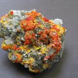Pyrite, realgar, pararealgar, orpiment, quartz
Palomo Mine, Castrovirreyna, Huancavelica, Peru
6.4 x 5 x 3.2 cm (Author: B&A)