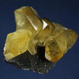 Calcite
Daye County, Huangshi Prefecture, Hubei Province, China
91.0 x 83.0 x 43.0 mm

Blocky, lustrous amber-yellow crystals of Calcite to 33 x 26 mm are perched on dark black limestone matrix. (Author: GneissWare)