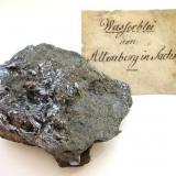 Molybdenite
Altenberg tin mine, Erzgebirge, Saxony, Germany
6 x 5 cm
The label shows the old German name "Wasserblei" (water lead) (Author: Andreas Gerstenberg)