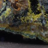 Plumbogummite, Mimetite, Quartz, Limonite and  Manganese Oxides
Dry Ghyll, Caldbeck Fells, Cumbria.
Here we see what appears to be a layer of Mimetite with a layer of Plumbogummite on top of it with a layer of Manganese Oxide on top of that, neat eh? FOV 20 mm across approx (Author: nurbo)