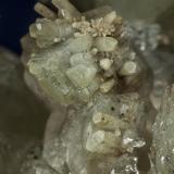 Calcite, Quartz, Muscovite
Rist Mine, Hiddenite, Alexander Co., North Carolina, USA

Detail (Author: am mizunaka)