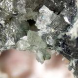 Nepheline
Poudrette quarry (Demix quarry; Uni-Mix quarry; Desourdy quarry; Carrière Mont Saint-Hilaire), Mont Saint-Hilaire, Rouville RCM, Montérégie, Québec, Canada
FOV=4mm
Crude crystals on massive nepheline (Author: Doug)