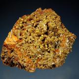 Pyromorphite
Les Farges Mine, Correze, Limousin, France
5.8 x 7.2 cm.
Olive green barrel-shaped crystals to 1.2 cm. with mustard yellow tips on iron-stained barite. (Author: crosstimber)