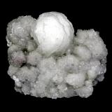Stellerite
Braen Quarry, Haledon, Passaic County, New Jersey, USA
6.2 x 5.4 cm
A 3.3 cm stellerite sphere on a crystallized stellerite druse (Author: Frank Imbriacco)