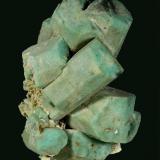 Microcline (v. Amazonite) -- before cleaning
Lake George area, Park County, Colorado, USA

130 x 124 x 104 mm

Classic, old-time Colorado Amazonite with sharp, light greenish-blue, blocky crystals of Microcline, on a matrix of white Albite (v. Cleavlandite). The Amazonites are well formed and fully terminated, several of which are well-developed twins. One crystal has a "slot" where it once enclosed a blade of what was likely Cleavlandite. This is an old AE Foote specimen, and was later sold by Filer&rsquo;s (Redlands, CA) and the Bradleys (Los Angeles). Formerly in the Don Boydston and Joel D. Cohen collections. It is complete on all sides, unrepaired and has no damage. (Author: GneissWare)