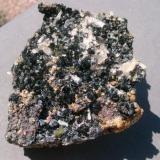 A 15 cm piece of andradite-hematite-chlorite-quartz. Much cleaner than it appears in the photo! (Author: Darren)