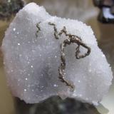 Pyrite "worms" on quartz  5 cm across (Author: Peter Megaw)