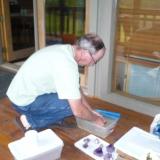 Terry washing some crystals at his cabin. (Author: John S. White)