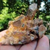 Quartz with Hematite + Golden/Clear Rutile
Lake Bonaparte State Forest, Lewis Co., New York, USA
70 x 61 x 49 in mm.
Such a colorful specimen, This one features the largest single point found at this location. (Author: NYFineMineralExchange)