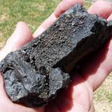 Iron bearing rock with strange crystals.
Western Cape, South Africa
85 x 52 mm
This black rock hosts some dark unknown crystals of a type I have never seen from this area. (Author: Pierre Joubert)