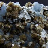 Vesuvianite on Calcite.
Sierra de Cruces, Mun de Sierra Mojada, Coahuila, Mexico.
FOV 30 x 25 mm approx (Author: nurbo)
