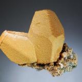 Siderite ps. after calcite
Broken Hill Mine, Aggenys, N. Cape Prov., South Africa
7.1 x 8.2 cm.
Two hollow, brown molds after barrel-shaped calcite crystals with blunt trigonal terminations. (Author: crosstimber)