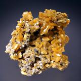 Wulfenite
Zelidja Mine, Touissit, Oujda-Angad Prov., Morocco
6.3 x 6.9 cm.
Tabular yellow wulfenite crystals to 1.0 cm on edge. (Author: crosstimber)