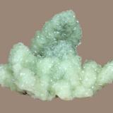 Prehnite
Prospect Park Quarry, Prospect Park, Passaic County, New Jersey, USA
10.3 x 7.2 cm
Prehnite epimorphs after anhydrite covered with lustrous calcite crystals (Author: Frank Imbriacco)