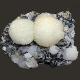 Stilbite and heulandite
Braen Quarry, Haledon, Passaic County, New Jersey, USA
5.9 x 4.7 cm
Stilbite spheres with heulandite (Author: Frank Imbriacco)