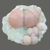 Pectolite and datolite
Millington Quarry, Bernards Township, Somerset County, New Jersey, USA
6 x 5 cm
Pink pectolite spheres on datolite peppered with micro hematite crystals (Author: Frank Imbriacco)