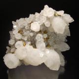 Quartz
Suior Mine, Cavnic, Maramures, Romania
8.2 x 10.1 cm.
Milky quartz crystals with transparent terminations associated with small brassy chalcopyrites. (Author: crosstimber)