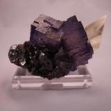 Fluorite, Calcite, Sphalerite
Elmwood Mine, Smith County,  Tennessee, USA
12.5 x 7.5 x 6.5 cm
The Fluorite has razor sharp edges

The Calcite has a perfect sharp termination (Author: Don Lum)