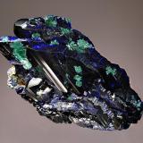 Azurite
Tsumeb Mine, Tsumeb, Namibia
4.5 x 6.7 cm.
Parallel growth of lustrous dark blue azurite crystals partially altered to malachite. (Author: crosstimber)