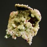 Smithsonite ps. cerussite
Tsumeb Mine, Tsumeb, Namibia
4.3 x 4.6 cm.
Drusy green cuprian smithsonite replacing cerussite with pink dolomite and colorless calcite on the reverse side. (Author: crosstimber)