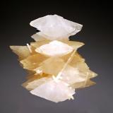 Calcite
Verchniy Mine, Dal’negorsk, Primorskiy Kray, Russia
4.1 x 4.6 cm.
Two generations of scalenohedral calcites ranging in color from honey-colored to colorless, with rod-shaped crystals of milky-white aragonite. (Author: crosstimber)