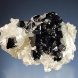 Ilvaite on quartz
Nikolaevskiy Mine, Dal’negorsk, Primorskiy Kray, Russia
4.4 x 5.8 cm.
Doubly terminated ilvaite crystals scattered over a quartz matrix. (Author: crosstimber)