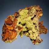 Mimetite
Ojuela Mine, Mapimi, Durango, Mexico
8.5 x 10.5 cm.
Groups of yellow-green crystals to 3.0 mm coating a gossan matrix with minor calcite and wulfenite. (Author: crosstimber)