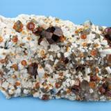 Spessartine, orthoclase, quartz, muscovite
Wushan Spessartine Mine, Tongbei, Yunxiao Co., Zhangzhou Prefecture, Fujian Province, China
93 mm x 49 mm x 36 mm

Full view (Author: Carles Millan)