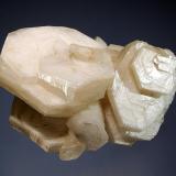 Calcite
Charcas, San Luis Potosi, Mexico
5.2 x 7.0 cm.
A cluster of lustrous, hexagonal white calcite crystals with the classic ‘poker chip’ habit. (Author: crosstimber)