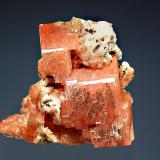 Serandite
Poudrette Quarry, Mont Saint-Hilaire, Monteregie, Quebec, Canada
3.8 x 4.0 cm.
Blocky salmon-colored serandite crystals with minor white albite and reddish-brown microcrystals of manganoneptunite. (Author: crosstimber)