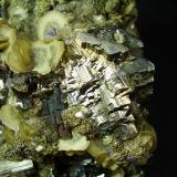 Arsenopirita-Pirita-Siderita-Fluorita-Apatito-Ferberita
Mina Panasqueira, Covilha, Portugal

Detalle Arsenopirita (Autor: geoalfon)