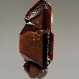 Rhodochrosite
Poudrette Quarry, Mont Saint-Hilaire, Monteregie, Quebec, Canada
1.0 x 2.5 cm.
Dark red twinned rhodochrosite crystal. (Author: crosstimber)