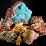 Hemimorphite, pyromorphite, plumbogummite, mimetite, philipsburgite, duftite.
Roughton Gill, Dry Gill, Brandy Gill, Driggieth Mines, Caldbeck Fells, Cumbria, UK.
The loose pyromorphite in the foreground, from Roughton Gill S lode open cut is 25 mm tall. (Author: Ru Smith)