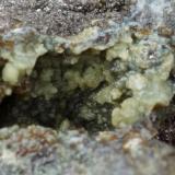 Scorodite with arsenopyrite, pyrite and quartz.
Brandy Gill, Mosedale, Caldbeck Fells, Cumbria, UK.
Field of view 8 mm, 65 mm specimen. (Author: Ru Smith)