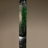 Elbaite
Santa Rosa Mine, Malacacheta, Minas Gerais, Brazil
1.0 x 7.5 cm.
A dark green zoned elbaite with a pyramidal termination. (Author: crosstimber)