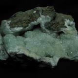 Prehnite
Sgurr nan Cearcall, nr Glen Brittle, Isle of Skye, Scotland, UK
12cm x 7cm x 5cm
The nicest prehnite specimen I have found, collected from a random small boulder on my last visit - I was very pleased ! The colour is a stronger green than the last specimen photo, but it is very difficult to capture.
Self-collected 2011 (Author: Mike Wood)