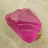 Corundum (variety ruby)
Mogok, Burma.
7 mm crystal in 3 cm calcite matrix.
Transparent trigonal crystal in calcite matrix. (Author: Ru Smith)