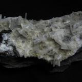 Stilbite + ’Mesolite’
Sgurr nam Fiadh, Isle of Skye, Scotland, UK
9cm x 5cm x 3cm
Unusual stilbite crystals to 13mm long on ’mesolite’ (could be natrolite).
Self-collected 1999 (Author: Mike Wood)