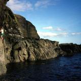 Ollisdal Geo, Duirinish, Isle of Skye, Scotland, UK
Photo (courtesy of D.I Green) of me trying to get across the steep bit. I retreated as I was in danger of getting wet and it was a long walk back to the car ! Photo taken same day as the previous stilbite specimen was collected in May 1996. (Author: Mike Wood)