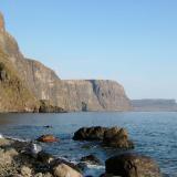 Moonen Bay, Isle of Skye, Scotland, UK
Looking across Moonen Bay (southward). The cliffs are very steep, often with rockfall, especially when it rains. The tide cuts off access to most of the &rsquo;beach&rsquo; at the foot of the cliffs. The cliffs in the distance (Ramasaig Cliff) reach over 700&rsquo; high (230m).
Photo taken April 2005 (Author: Mike Wood)