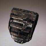 Tantalite-Fe
Fazenda Pomorolli, Linopolis, Minas Gerais, Brazil
2.8 x 3.3  cm.
A single lustrous metallic black tantalite crystal collected in June 2010. (Author: crosstimber)